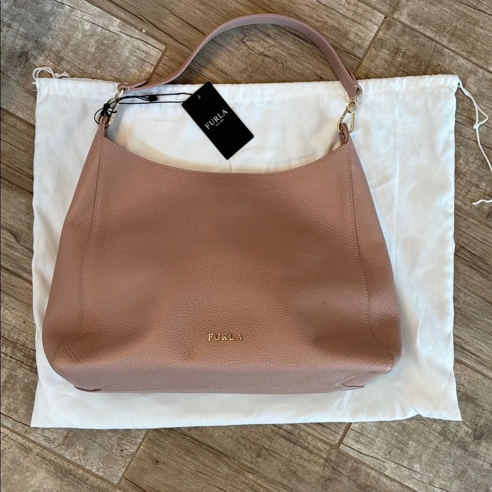 Furla Grace medium bag in a light pink. Comes with Dustbag. NWT